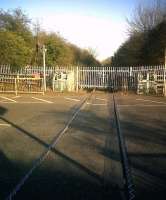 The crossing over the industrial estate road at Brackmills on the stub of the Bedford line near the Geismar works [see image 33285]. Notice the zigzag weld lines for audible warning, and the sleepers laid across the road.<br><br>[Ken Strachan 18/03/2011]
