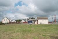 Site of the former Whithorn station in May 2011. The picture is taken from the location of the old platform looking north away from the terminus. The line closed to passengers in 1950 but goods trains continued until 1964, latterly thrice weekly. The fire station and other buildings were constructed on the old railway land in the early 1990s. [See image 6541] for the same location just prior to final closure.<br><br>[Mark Bartlett 26/05/2011]