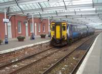 Corkerhill set 156445 on the 1443 from Stranraer is seen here arriving a couple of minutes early in bay Platform 1 at its destination, Kilmarnock. It will shortly make another round trip to Stranraer as the 1704 departure and 1933 return. <br><br>[Mark Bartlett 25/05/2011]