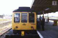 Looking out over the buffer stops alongside platform 1 of Morecambe Promenade station in the summer of 1989, some 5 years before the station closed. The DMU preparing to leave the platform is adorned with a <I>'Buxton Spa Line'</I> logo on its nose and is displaying a destination panel reading <I>'Heysham Sea Terminal for IOM'</I>. Happily, despite losing its train service in 1994, Morcambe Promenade station still stands [see image 18660].<br><br>[Ian Dinmore /07/1989]