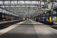 Class 380s are now the norm for the majority of services on the Ayrshire and Inverclyde lines, and have displaced the Class 334s on these routes. The view along Platforms 11 and 12 at Glasgow Central on 31 May shows 380108 waiting to depart for Gourock from Platform 10 (with another Class 380 on a Largs service in behind it), 380014 at the head of a seven car train for Ayr at Platform 11 and 380012 at Platform 12 awaiting its next turn of duty. <br><br>[Graham Morgan 31/05/2011]