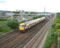 A mid-morning Milngavie - Edinburgh Waverley train runs east at Saughton Junction on 31 May and will soon begin to slow for the stop at Haymarket.<br><br>[John Furnevel 31/05/2011]