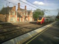 A Northbound double Voyager runs through long shadows at the rather diminished station at Atherstone, between Nuneaton and Tamworth, on 1 June 2011. The vet who currently uses the station building has about 50 parking spaces, as opposed to ten for rail passengers! But the service level has rebounded, with approximately one train an hour each way. It was a lot worse 5 years ago.<br><br>[Ken Strachan 01/06/2011]