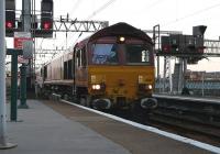 DBS 66111 brings the empty stock of the Caledonian Sleeper into Glasgow Central on 3 June 2011. [See image 34395]<br><br>[Ken Browne 03/06/2011]