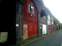 A fairly typical selection of traditional railway arch businesses at Bath Spa - not looking particularly thriving in this case. View is towards Bristol on 29 May 2011.<br><br>[Ken Strachan 29/05/2011]