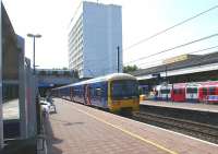 A First Great Western Class 165 Networker calls at Ealing Broadway <br>
on 4 June 2011 with a westbound service. On the right are the London <br>
Underground platforms of the Central and District lines. <br>
<br><br>[John McIntyre 04/06/2011]