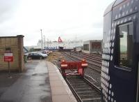 Ferry connection made. Scotrail 156506 looks out from the Harbour trainshed as <I>MV Stena Caledonia</I> turns after reversing out of its berth and heads into Loch Ryan with a Belfast sailing. A number of the passengers on the ferry had arrived on the first train from Glasgow - and others who had arrived on the ship now joined it for a 10.05hrs departure north. <br><br>[Mark Bartlett 25/05/2011]