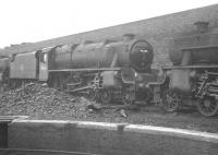 With only a month to go before official withdrawal by BR, Stanier Black 5 no 44690 stands alongside Rose Grove shed, Burnley, in July 1968. The locomotive is seen sandwiched between resident classmates  43597 (left) and 44899, also facing imminent withdrawal.<br><br>[K A Gray /07/1968]