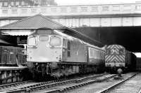 5399 ready to leave Waverley in 1974, with steam escaping from the train heating pipes and 'Brutes' standing on the platform. A 350HP shunter waits alongside.<br><br>[Bill Roberton //1974]