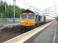 GBRf 66723 <I>'Chinook'</I> rumbles through Holytown on 3 June with the 6S45 North Blyth to Fort William Alcan tanks.<br><br>[Ken Browne 03/06/2011]