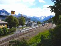 The picturesque station at Andalsnes, Norway, in June 2011.  A train of NSB type 93 DMUs awaits tourists from the cruise ship for a trip on the Rauma Railway as far as Bjorli [see image 34414].<br><br>[John Robin 02/06/2011]