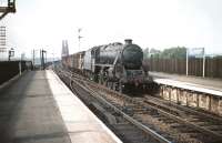 Black 5 no 45172 brings a southbound freight off the Forth Bridge and hurries through Dalmeny station in August 1959. Note the first vehicle.<br><br>[A Snapper (Courtesy Bruce McCartney) 08/08/1959]