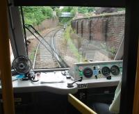 Drivers console in Parry People Mover 139001 waiting to leave Stourbridge Town for Stourbridge Junction. PPMs are powered by a flywheel and the left hand dial is the flywheel rev counter. This is spooled up by an input from the engine or by regenerative braking and the revs could be seen climbing as the unit dropped down to the branch terminus. The flywheel, seen here turning at 2000RPM prior to departure, then powers the vehicle back up the hill to the junction. The Class 139 unit makes six return trips an hour on the branch and must be very economical in fuel use compared to its Class 153 predecessor, which operated a fifteen minute interval service.<br><br>[Mark Bartlett 08/06/2011]