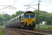 Freightliner locomotive 66515 hauls a rake of 19 coal hoppers north <br>
past Woodacre on the WCML on 31 May 2011 heading back to Scotland for reloading.<br><br>[John McIntyre 31/05/2011]