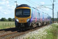 A Manchester Airport - Edinburgh Waverley service operated by First TransPennine Express heads north along the WCML near Brock, between Preston and Lancaster, on 31 May 2011.<br>
<br><br>[John McIntyre 31/05/2011]