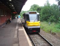 Parry People Mover 139001 waits for connecting passengers at Stourbridge Junction. Behind the unit one of the smaller traction depots on the mainline network can be seen. SJ has an allocation of just two Class 139 PPMs. The station itself was once in poor condition but is now well maintained. [See image 13205] for the same view in 1974.<br><br>[Mark Bartlett 08/06/2011]