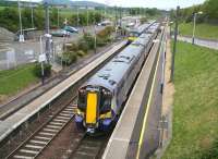 Old meets new at Musselburgh on Saturday 11 June 2011. One of the new units earmarked for the North Berwick route, no 380104, stands at platform 1 with the 08.40 service from Waverley, while no 322485, one of the units which will be displaced, pulls away from platform 2 with the 07.56 North Berwick - Glasgow Central via Edinburgh and Carstairs.<br><br>[John Furnevel 11/06/2011]