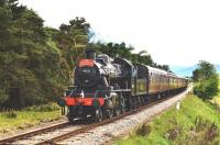 Strathspey Railway Ivatt 2MT Mogul no 46512 heading north midway between Broomhill and Boat of Garten on 12 June 2011 hauling <I>'The Strathspey Clansman'</I>. <br>
<br><br>[John Gray 12/06/2011]