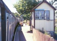 Platform scene looking south at Forsinard on a warm and sunny day in the summer of 1975. The north signal box is on the right, with the south box standing in the distance on the other side of the level crossing.<br><br>[Ian Dinmore /07/1975]