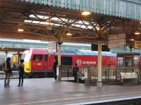 Pristine DB Schenker liveried 60011 runs west through Cardiff Central station on 7 June hauling the lengthy Westerleigh to Robeston empty Murco tanks.<br><br>[David Pesterfield 07/06/2011]