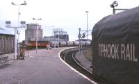 A Class 47 in Rail Express Services livery eases a northbound tank train round the Rose Street curve in Inverness. The Tiphook freight wagon is part of an exhibition on Platform 1 to mark the occasion of the April 1997 Rail Freight Group conference in Inverness.<br>
<br><br>[David Spaven /04/1997]