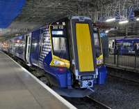 Class 380s in the east end bays at Waverley on 14 June. 380103 lurks at platform 4 with sister unit 380104 on the right at platform 3.<br><br>[Bill Roberton 14/06/2011]