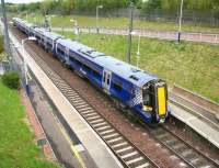 One of the new units on the North Berwick route, no 380104, calls at Musselburgh's platform 1 on 11 June with the 08.40 ex-Waverley.<br><br>[John Furnevel 11/06/2011]