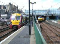 Looking back towards the east end of Waverley along platform 7 on 14 June 2011. 334002 is at the platform with 90018 and 67027 alongside in the locomotive bay.<br><br>[Veronica Clibbery 14/06/2011]