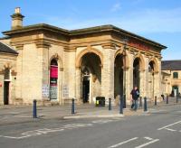 View east along Dundas Street, Saltburn, in April 2008, showing the former entrance to the 1861 Stockton and Darlington Railway station. The old station site and main entrance building now form part of a shopping mall, with a modern-day 2-platform train terminus located off to the left.<br><br>[John Furnevel 03/04/2008]