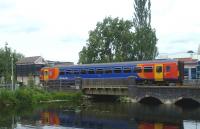 An East Midlands train leaving Lincoln on 17 June passing the disused East Holmes signal box.<br><br>[Bruce McCartney 17/06/2011]