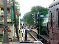 The token is handed over to the footplate as the 2.15pm departure leaves Holt for Sheringham on the North Norfolk Railway with Hunslet 0-6-0 saddle tank no 1982 <I>Ring Haw</I> in charge.<br><br>[Bruce McCartney 18/06/2011]