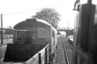 A class 26 with a freight at Tain in 1968. View is south-east with the old locomotive shed in the background. <br><br>[David Spaven //1968]