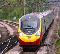 The message on the front of Virgin Pendolino 390052, beneath the name <I>Alison Waters</I>, reads <I>Alstom - Supporting British Athletes</I>. [Alison is a member of the British squash team.] The unit is heading south across Balshaw Lane Junction on 19 June 2011 with the 1058 hrs from Preston to London Euston.<br>
<br><br>[John McIntyre 19/06/2011]