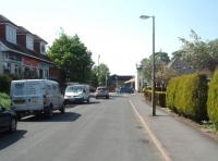 A Then and Now comparison with a David Hindle Collection photo of Longridge goods yard in 1966 [see image 34582]. In this April 2011 view the camera has been moved slightly left onto the old running line trackbed looking towards the station. The blue car is at the point where the level crossing was situated with the restored platform canopy beyond. The former goods yard is now covered by houses.<br><br>[Mark Bartlett 30/04/2011]