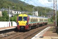 A Helensburgh Central to Edinburgh Waverley service photographed on 30 May 2011 passing non-stop eastbound through Bowling station. <br><br>[John McIntyre 30/05/2011]