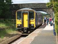 1533315 calls at Croston station with the 15.55 departure to <br>
Ormskirk on 18 June 2011. The disused former Preston bound platform on the left has been receiving attention to the undergrowth by the 'Friends of Croston Station' community group. After having been abandoned for over 40 years, it is quite a task - and quite interesting to see how much platform blockwork is being unearthed. [See image 36136]<br>
<br><br>[John McIntyre 18/06/2011]