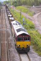 DBS 66025 leaves Millerhill with the 6S58 Lackenby - Dalzell loaded slab train on 20 June.<br>
<br><br>[Bill Roberton 20/06/2011]