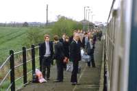 Commuters and school pupils throng the platform at Darsham as 37050 eases to a stop with the 07.57 Lowestoft to London Liverpool Street buffet car service on May 8th 1984. From the following Monday, locomotive hauled passenger services on the East Suffolk line were no more, as were through Lowestoft - London services until they were reinstated with turbostar units 15 years later.<br><br>[Mark Dufton 08/05/1984]