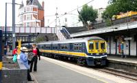 One of the original <I>Thameslink</I>- liveried dual voltage class 319 sets pulls into platform 1 at Kentish Town on 21 July 2005 with a Luton - Sutton service.<br><br>[John Furnevel 21/07/2005]