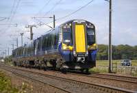 380 013 passing St Germains level crossing on 21 June 2011 with the 10.43 Edinburgh - North Berwick service.<br><br>[Bill Roberton 21/06/2011]