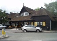 The rustic looking station at Port Sunlight, opened in 1925 in a style very much in keeping with the <I>garden village</I> that it serves. The booking office is still open and on weekdays there are six trains an hour to Liverpool, accessed through a subway to the high level platforms behind [See image 34643].<br><br>[Mark Bartlett 24/06/2011]