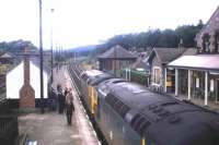 Guests of BR who had been viewing the reinstatement of the Highland Main Line's second track over Druimuachdar join the train back to Inverness at Blair Atholl in 1976.<br><br>[Frank Spaven Collection (Courtesy David Spaven) //1976]