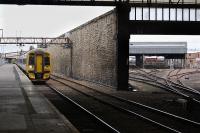 A six car 158 set with 158715 on the point arrives at Perth with the 10.47 from Inverness to Edinburgh on 25 June.  The train stabling area can be seen on the right.<br><br>[Bill Roberton 25/06/2011]