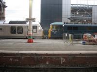 An unusual combination of motive power - an electric hauling a dead diesel! 86101 pauses at Preston with 67013 dead in tow on the final leg of the 'Three Peaks Challenge, from Fort William to Euston (see image 34640)<br><br>[Michael Gibb 25/06/2011]