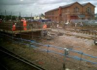 Strange and unexpected (but very welcome) goings-on in Bedford. These sidings in front of the old warehouses adjacent to the Hitchin line (see image 30471) are being thoroughly refurbished, and that brick building going up on the left would have been a signal box in days gone by. Probably a signing on point and sidings for Thameslink - even though they will need a reversal to reach Midland station, and preferably some wires overhead. Good job they didn't sell off the land years ago!<br><br>[Ken Strachan 17/06/2011]