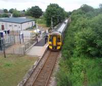 The 1236 from Wick calls at Alness on time at 1603 heading for Inverness. A couple of passengers join 158709 which will arrive in Inverness in 45 minutes time. View north towards Invergordon from the local academy footbridge.<br><br>[Mark Bartlett 29/06/2011]