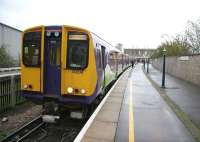 The final days of passenger services on the North Woolwich branch. An afternoon Silverlink North London Line train for Richmond stands ready to leave the platform in November of 2006.<br><br>[Ian Dinmore /11/2006]