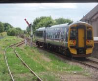 View south from Inverurie's platform as 158736, on a short working, heads back to Dyce and Aberdeen. Inverurie, like most stations on this line, is still controlled by mechanical signalling and pointwork.<br><br>[Mark Bartlett 30/06/2011]