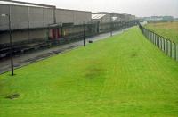 Looking west over what was Barleith station and Hurlford shed in 1988. Not much remained, although the warehousing was rail served.<br><br>[Ewan Crawford //1988]