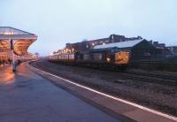 With 37607 leading and 37601 at the tail, the 1Z94 <I>Galloway Galloper</I> awaits right away at Kilmarnock station on 12 February 2011. The special had gone down the Riccarton branch and returned to the station before traversing the Barassie branch to its ultimate destination at Stranraer. No 37601 carries the name 'Class 37 - Fifty'. <br><br>[Ken Browne 12/2/2011]